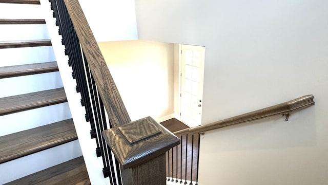 stairs with wood-type flooring