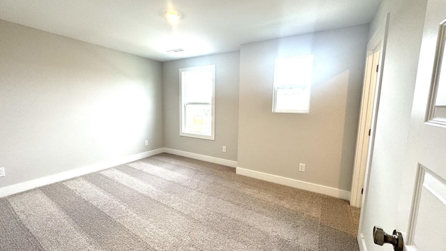 unfurnished room featuring carpet floors