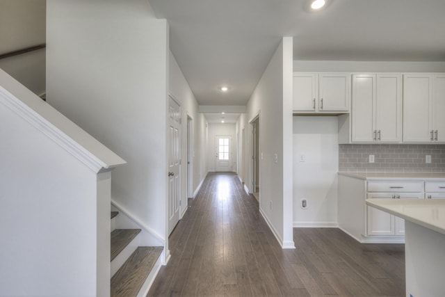 corridor featuring dark hardwood / wood-style flooring