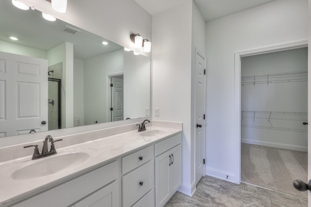 bathroom with a shower, vanity, and toilet