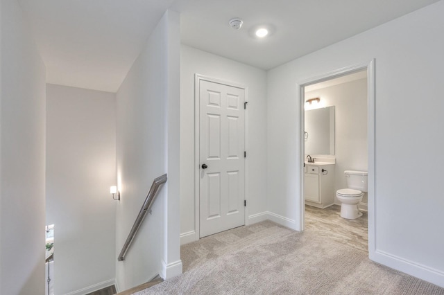 interior space featuring light colored carpet