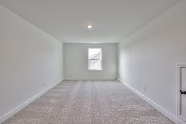 empty room with light colored carpet