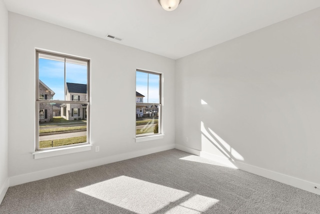 unfurnished room featuring carpet flooring