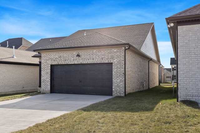 view of side of home with a garage and a lawn