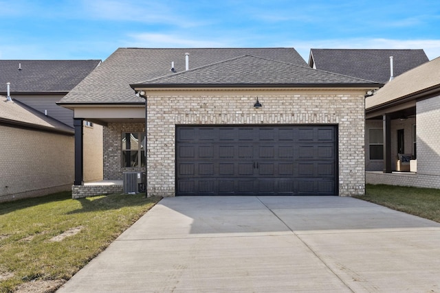 view of front of property with cooling unit, a garage, and a front lawn