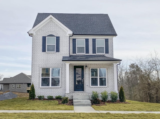 view of front of home with a front yard