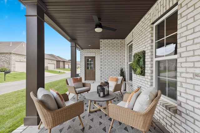 view of patio featuring ceiling fan