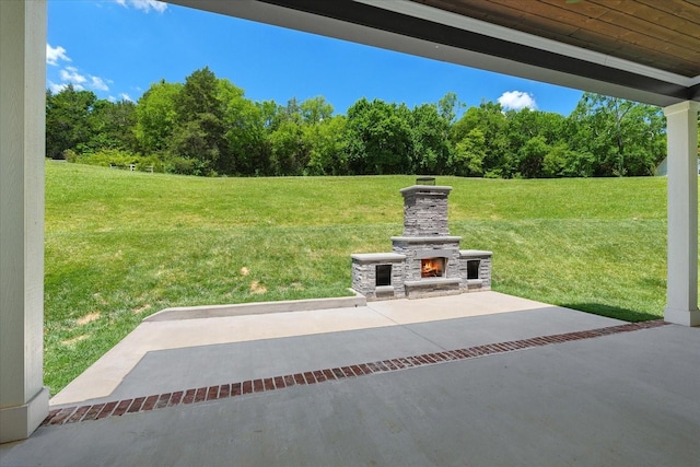 view of patio with an outdoor stone fireplace