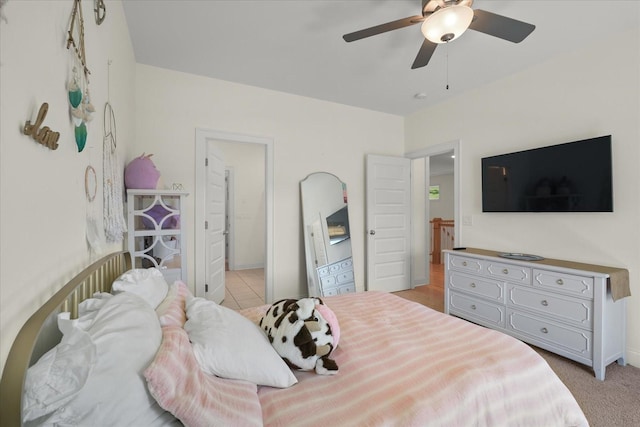 bedroom featuring ceiling fan and light colored carpet