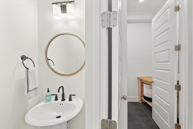 bathroom with sink and tile patterned flooring