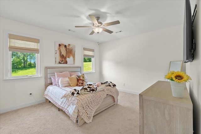 bedroom featuring ceiling fan and light carpet