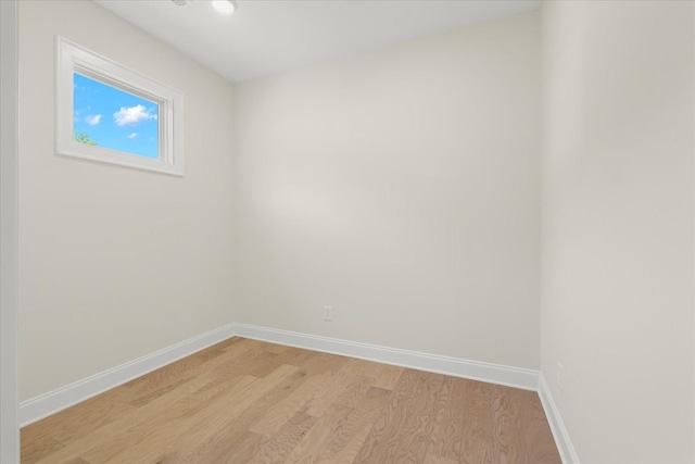 spare room featuring light hardwood / wood-style floors