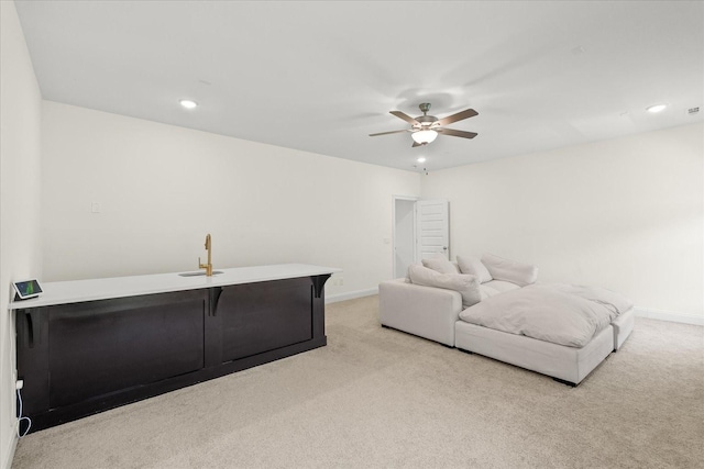 interior space featuring ceiling fan and sink