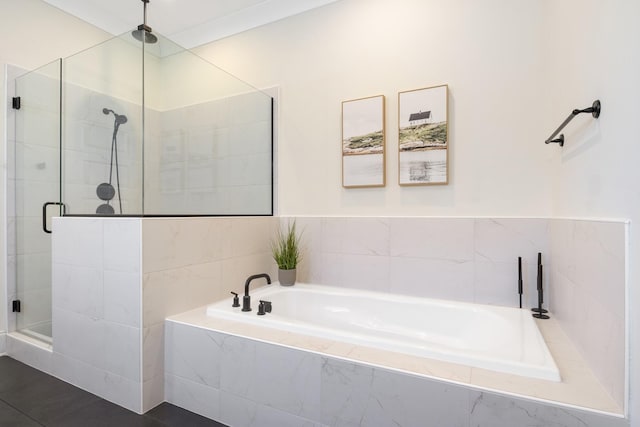 bathroom featuring separate shower and tub