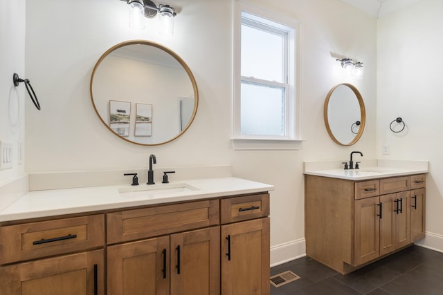 bathroom featuring tile patterned floors and vanity