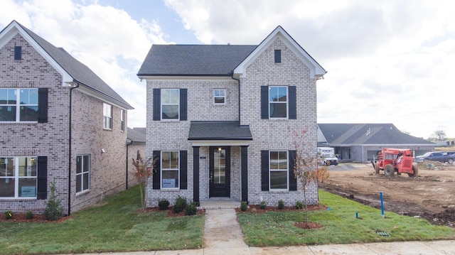 view of front of house featuring a front lawn