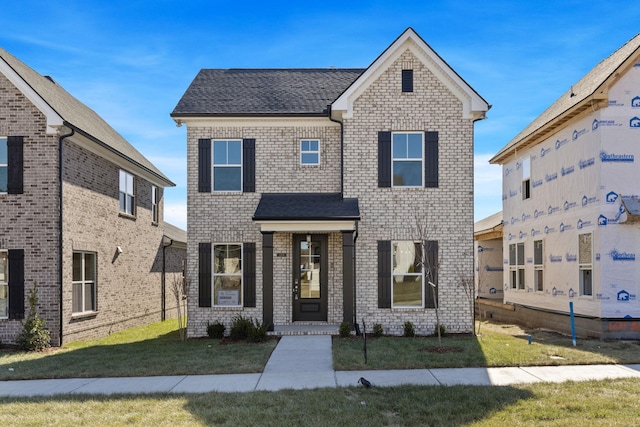 view of front of property with a front lawn