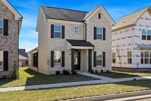 view of front of home with a front yard