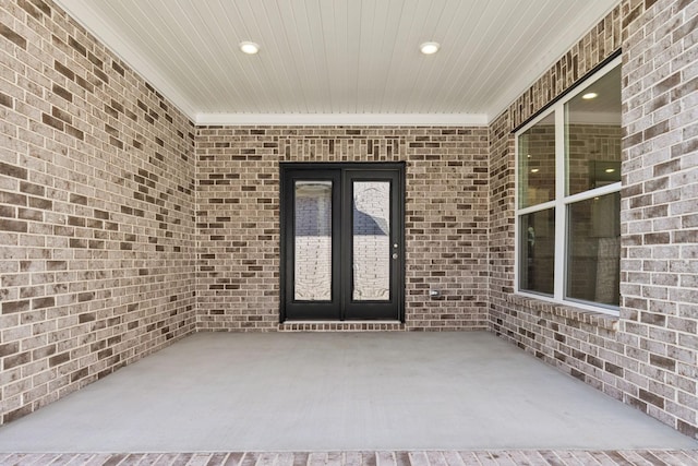 view of exterior entry featuring french doors