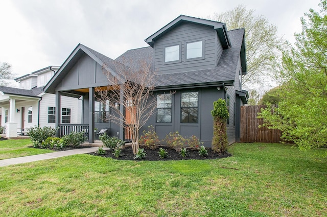 view of front of home with a porch and a front lawn