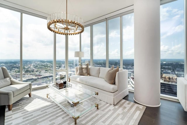 sunroom / solarium with an inviting chandelier