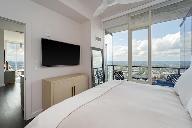 bedroom with ceiling fan and dark hardwood / wood-style floors