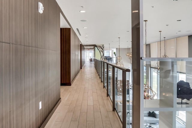 hall with light hardwood / wood-style flooring