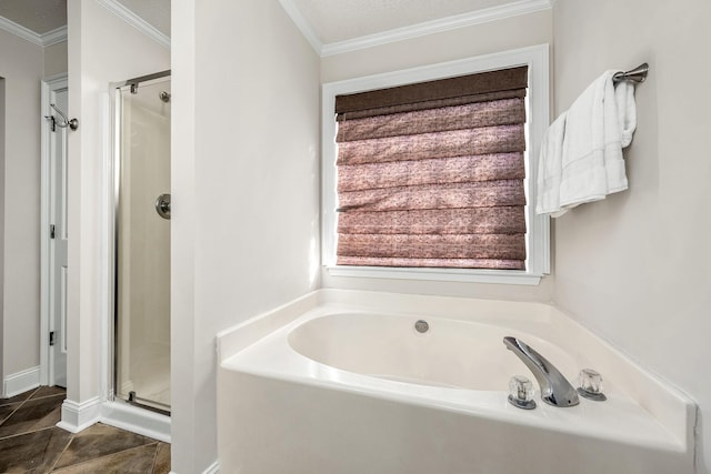 bathroom featuring ornamental molding, plus walk in shower, and a textured ceiling