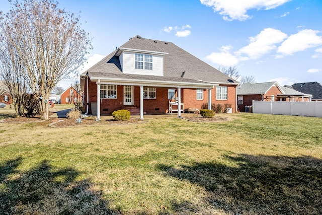 back of house with a yard