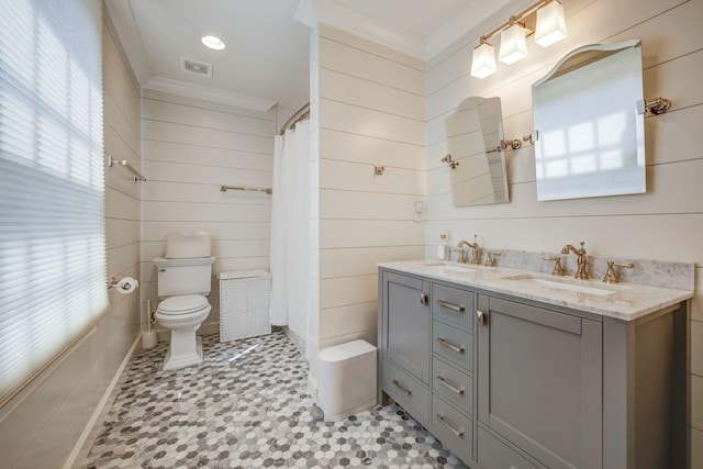 bathroom with walk in shower, toilet, vanity, and ornamental molding