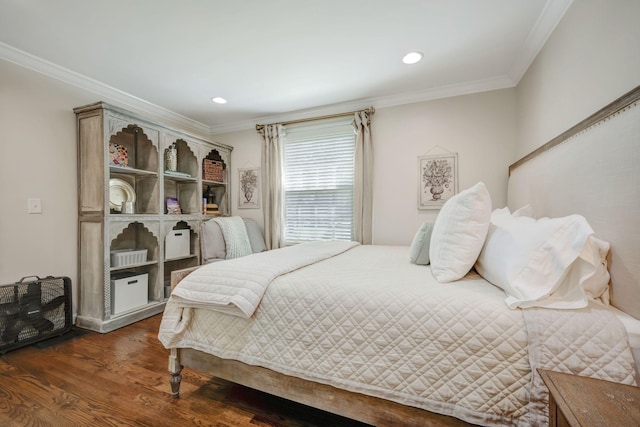 bedroom with dark hardwood / wood-style floors and ornamental molding