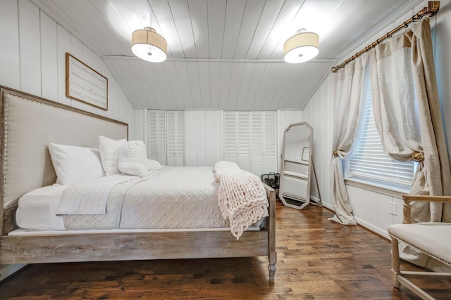 bedroom with dark hardwood / wood-style flooring, wood ceiling, and lofted ceiling