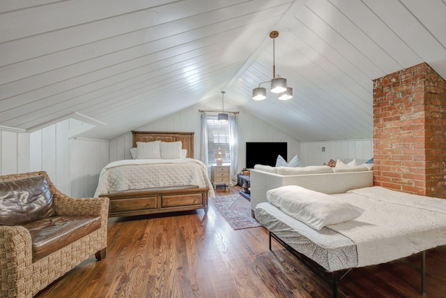 bedroom featuring dark hardwood / wood-style flooring, vaulted ceiling, and wooden walls