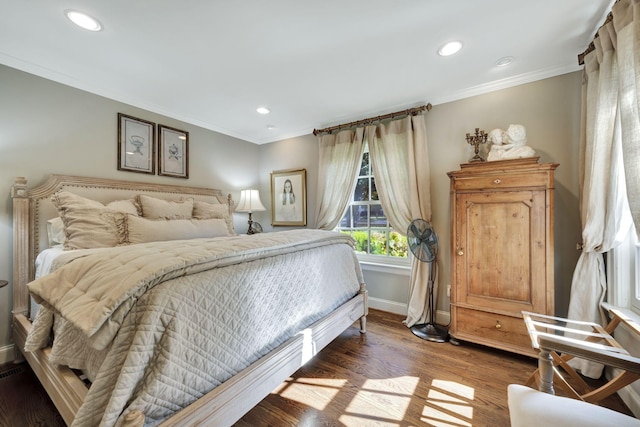 bedroom featuring dark hardwood / wood-style flooring and crown molding