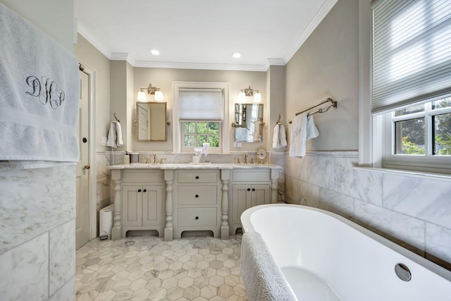 bathroom featuring vanity, plenty of natural light, tile walls, and a bathing tub