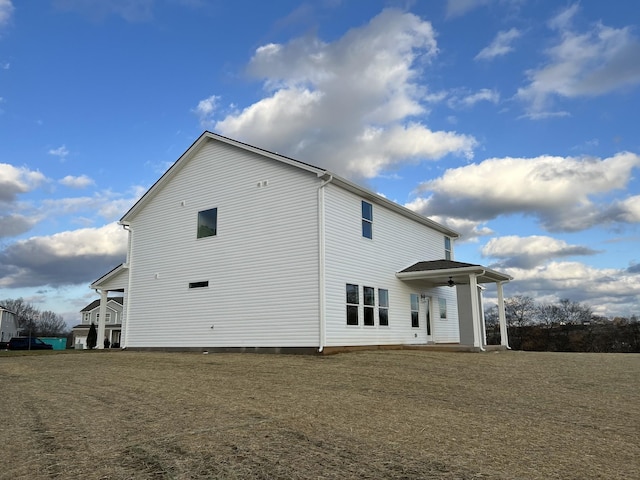 view of side of property featuring a yard