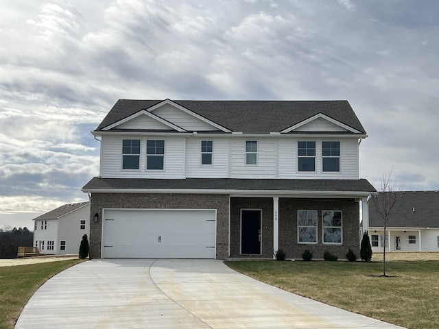 view of front of house with a front yard and a garage