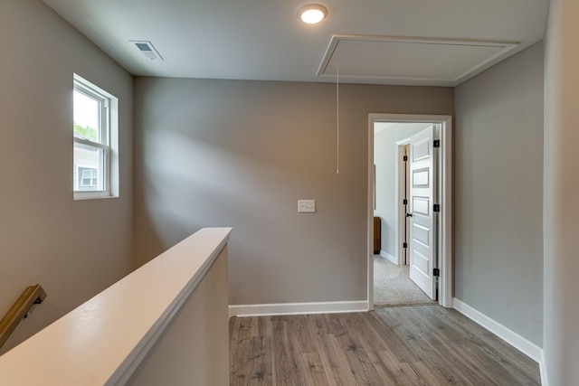 corridor with light wood-type flooring