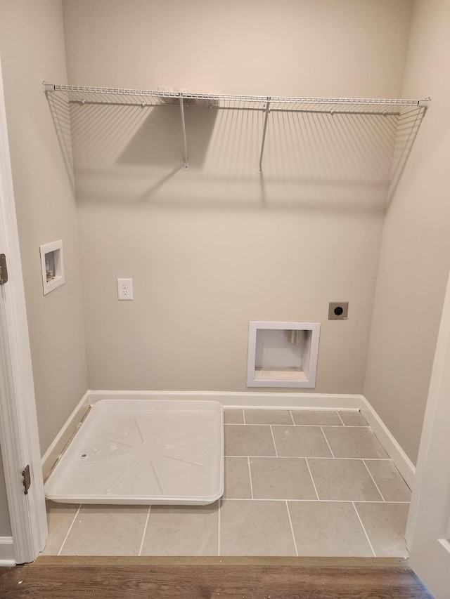 washroom featuring tile patterned floors, washer hookup, and electric dryer hookup