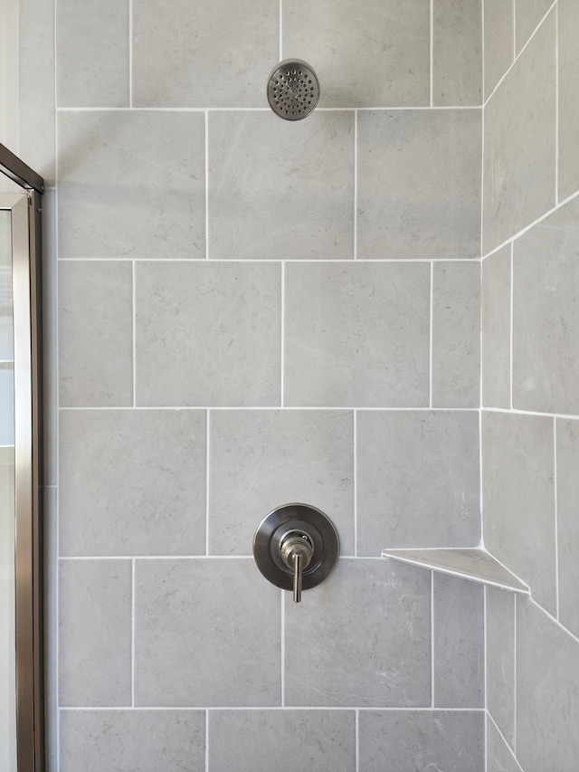 details with a tile shower