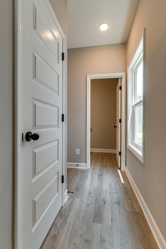 corridor featuring light wood-type flooring