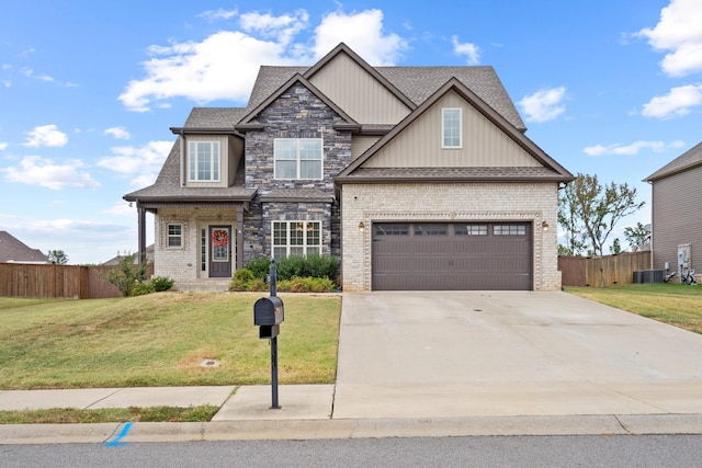 craftsman-style home featuring a front lawn and a garage