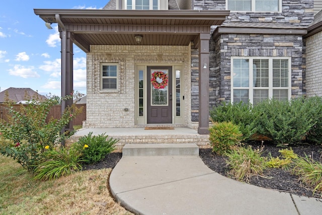 entrance to property featuring covered porch