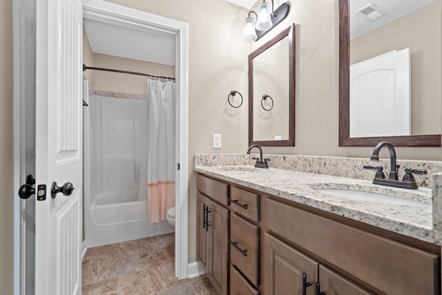 full bathroom with shower / bath combo with shower curtain, vanity, and toilet