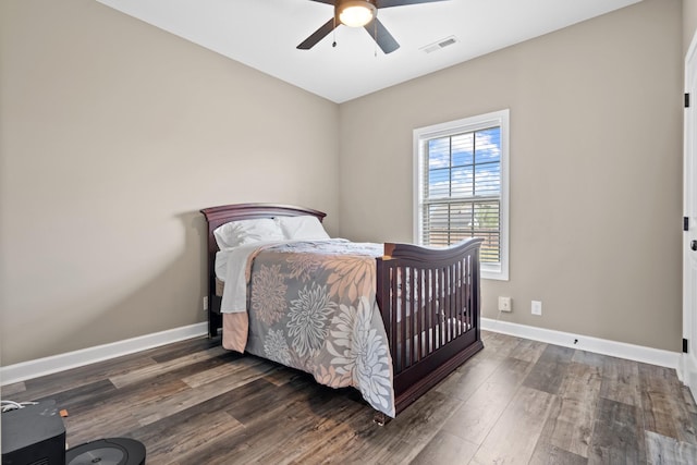 bedroom featuring ceiling fan and dark hardwood / wood-style flooring