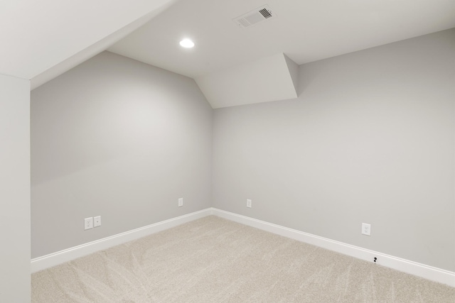 bonus room with carpet and vaulted ceiling