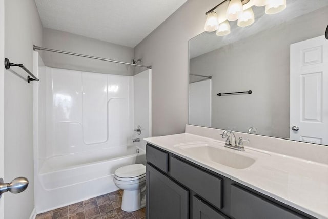 full bathroom with washtub / shower combination, vanity, and toilet