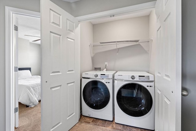 washroom featuring washer and clothes dryer, ceiling fan, and carpet floors