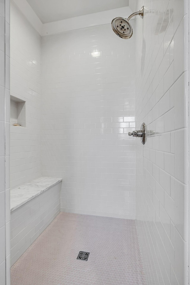 bathroom featuring a tile shower