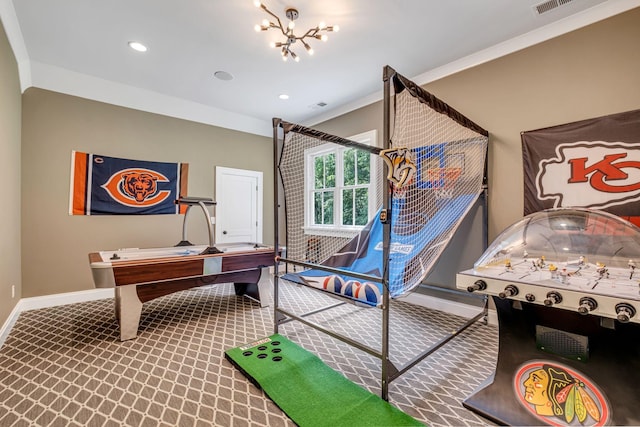 rec room featuring carpet flooring, crown molding, and a chandelier